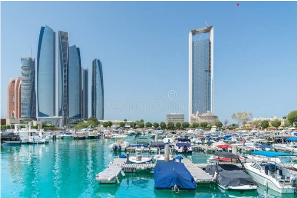 Al Bateen marina in Abu Dhabi with Etihad Towers in the background, covered by our car towing service