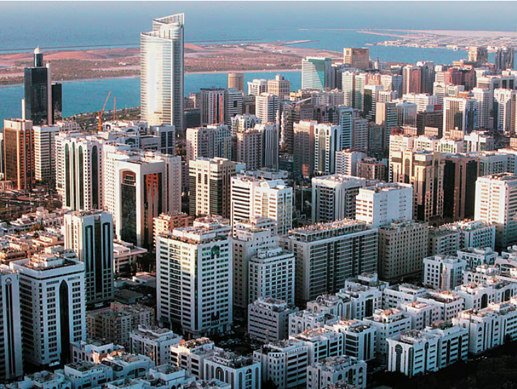 Aerial skyline view of Al Khalidiyah district in Abu Dhabi with coastal buildings, covered by our car towing service