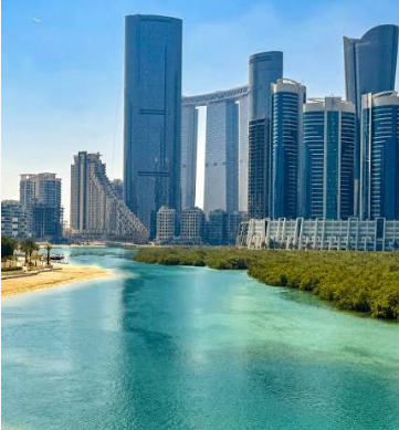 Waterfront skyline of Al Reem Island in Abu Dhabi with high-rise towers, covered by our car towing service